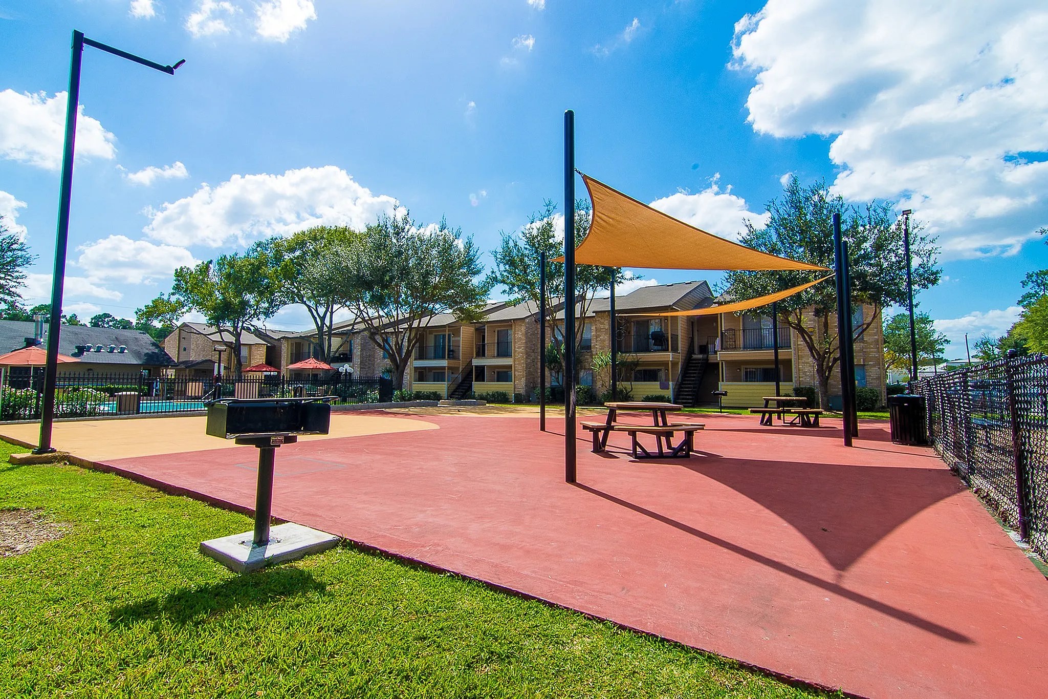 8455 Will Clayton Parkway, Unit 103 Humble, TX 77338 - Photo 10 of 23 a view of a patio with a table chairs and a backyard