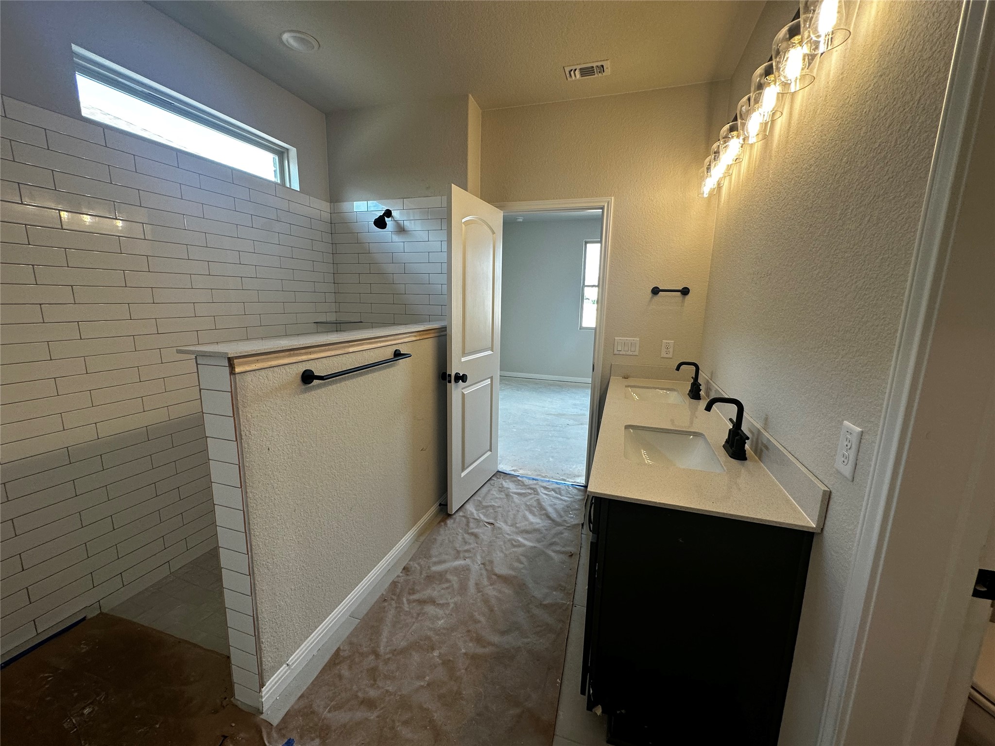 1053 Sienna Bear Road Georgetown, TX 78633 - Photo 15 of 32 a bathroom with a sink and mirror