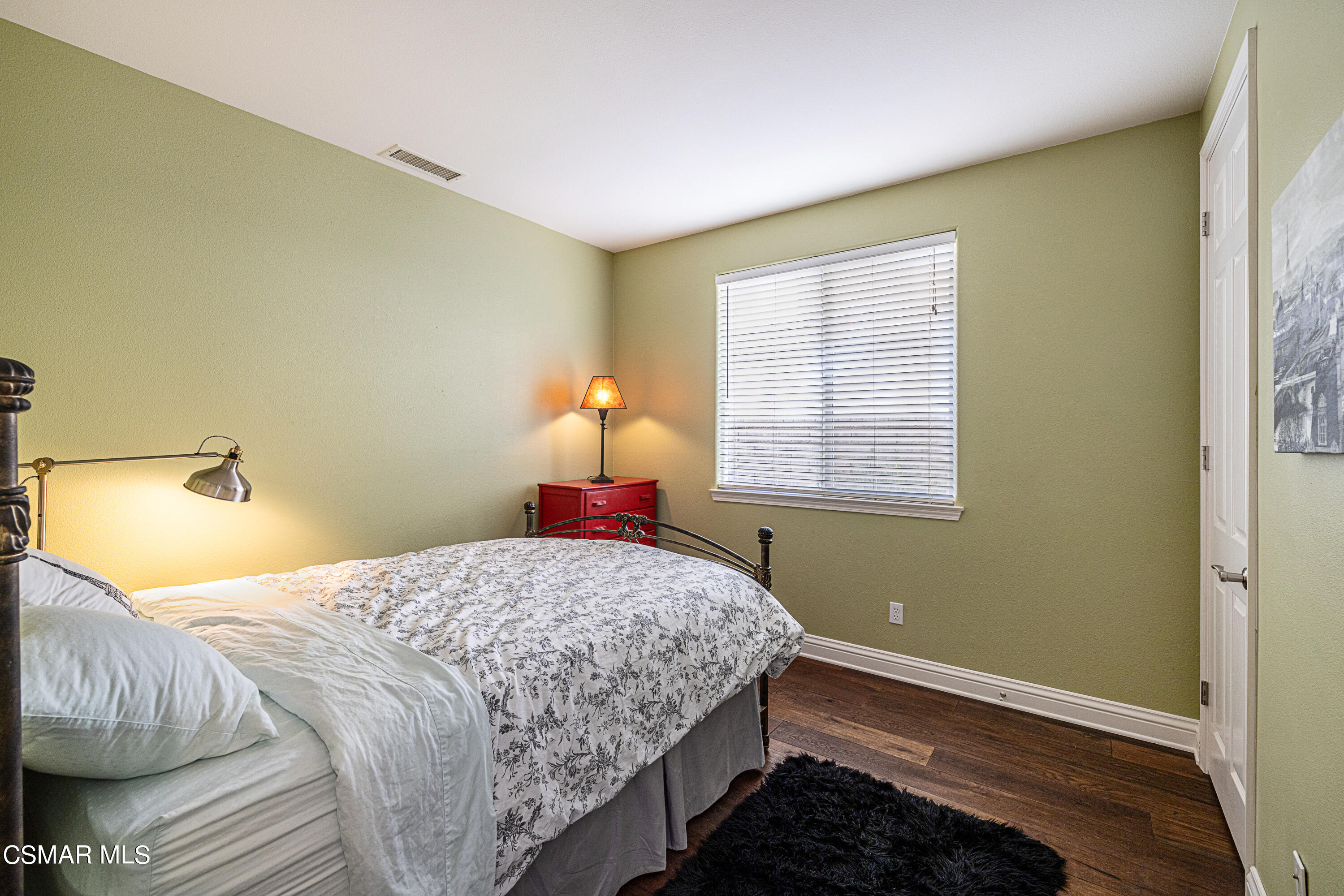 659 Corte Estrella Camarillo, CA 93010 - Photo 13 of 36 a bedroom with a bed and a window