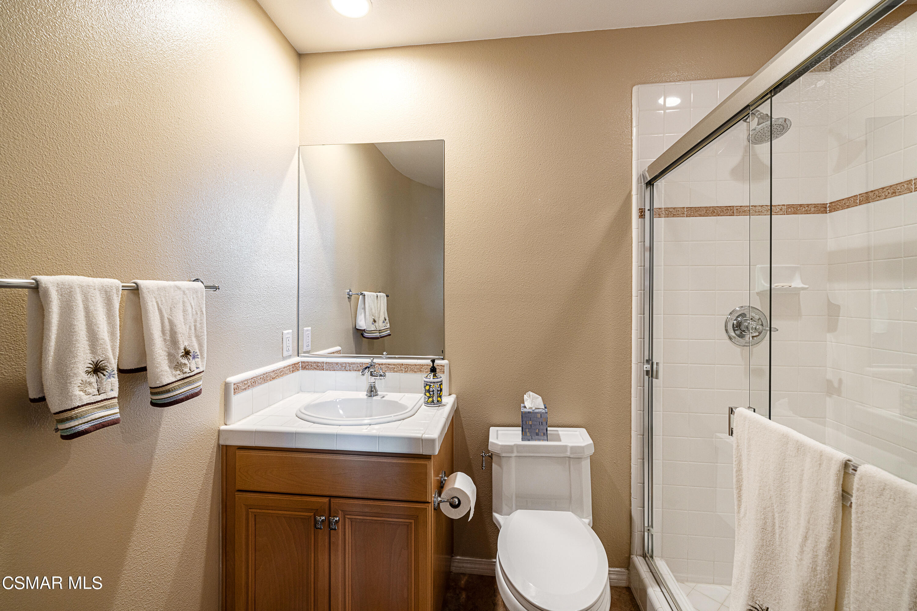 659 Corte Estrella Camarillo, CA 93010 - Photo 14 of 36 a bathroom with a sink toilet and shower