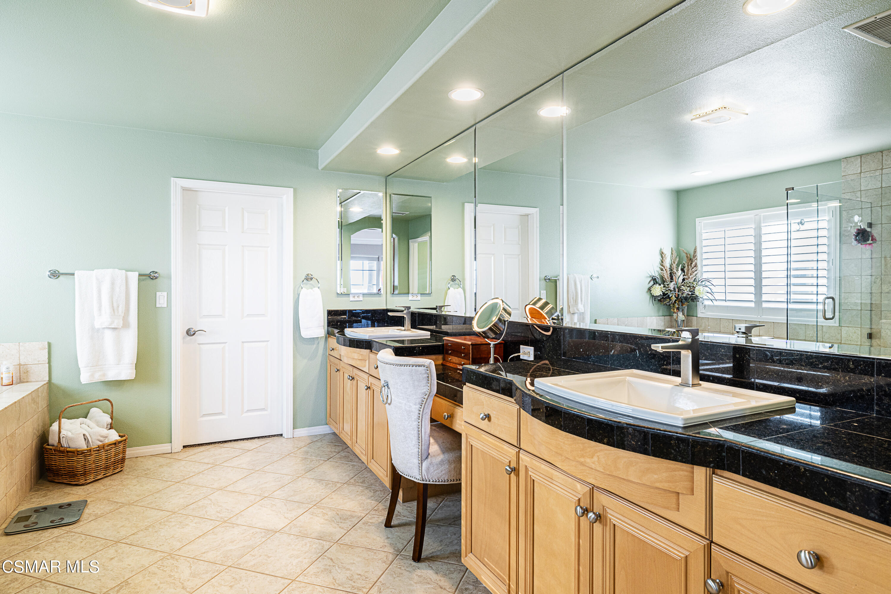 659 Corte Estrella Camarillo, CA 93010 - Photo 20 of 36 a kitchen with granite countertop a sink and white cabinets