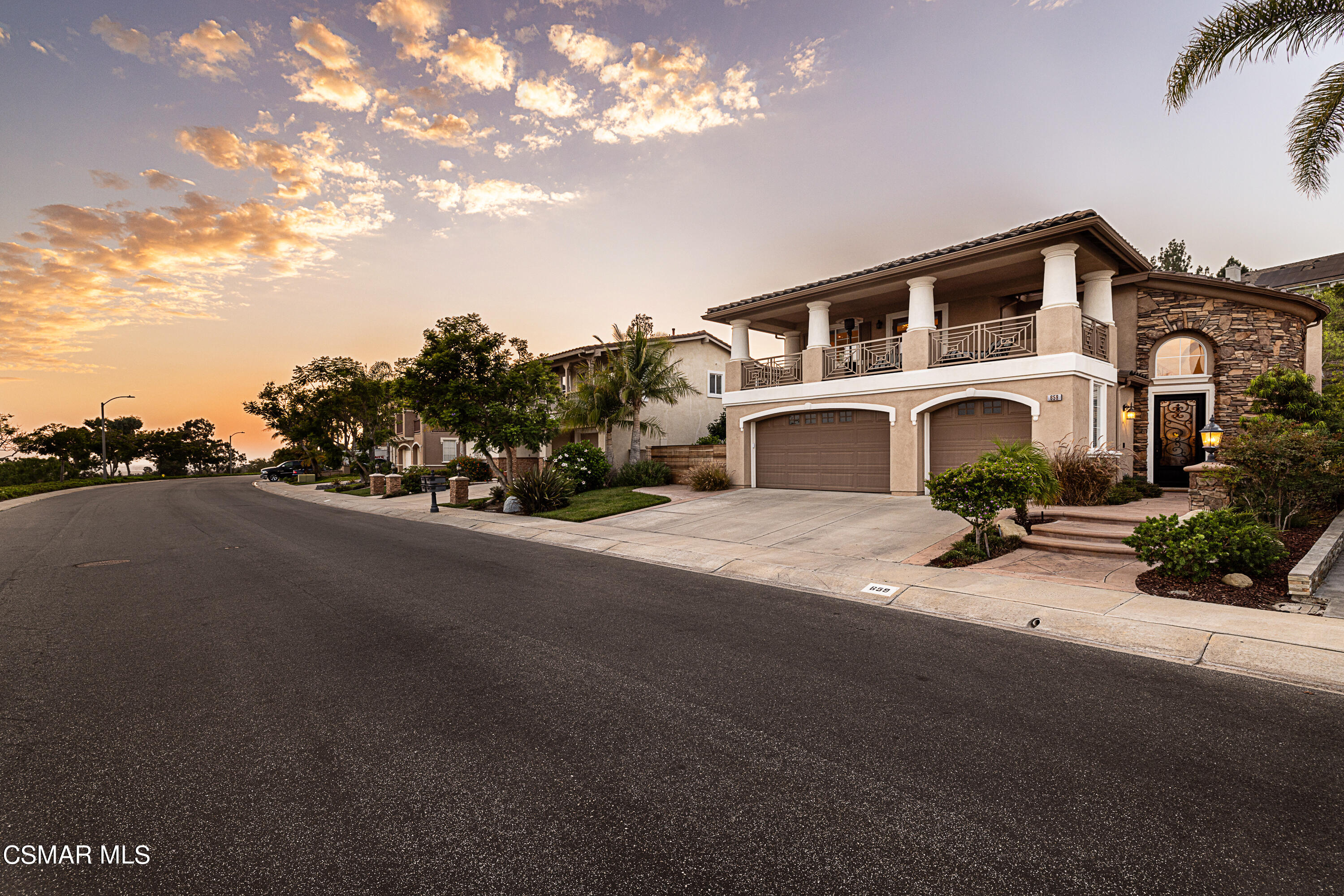 659 Corte Estrella Camarillo, CA 93010 - Photo 2 of 36 a front view of a house with a yard and garage