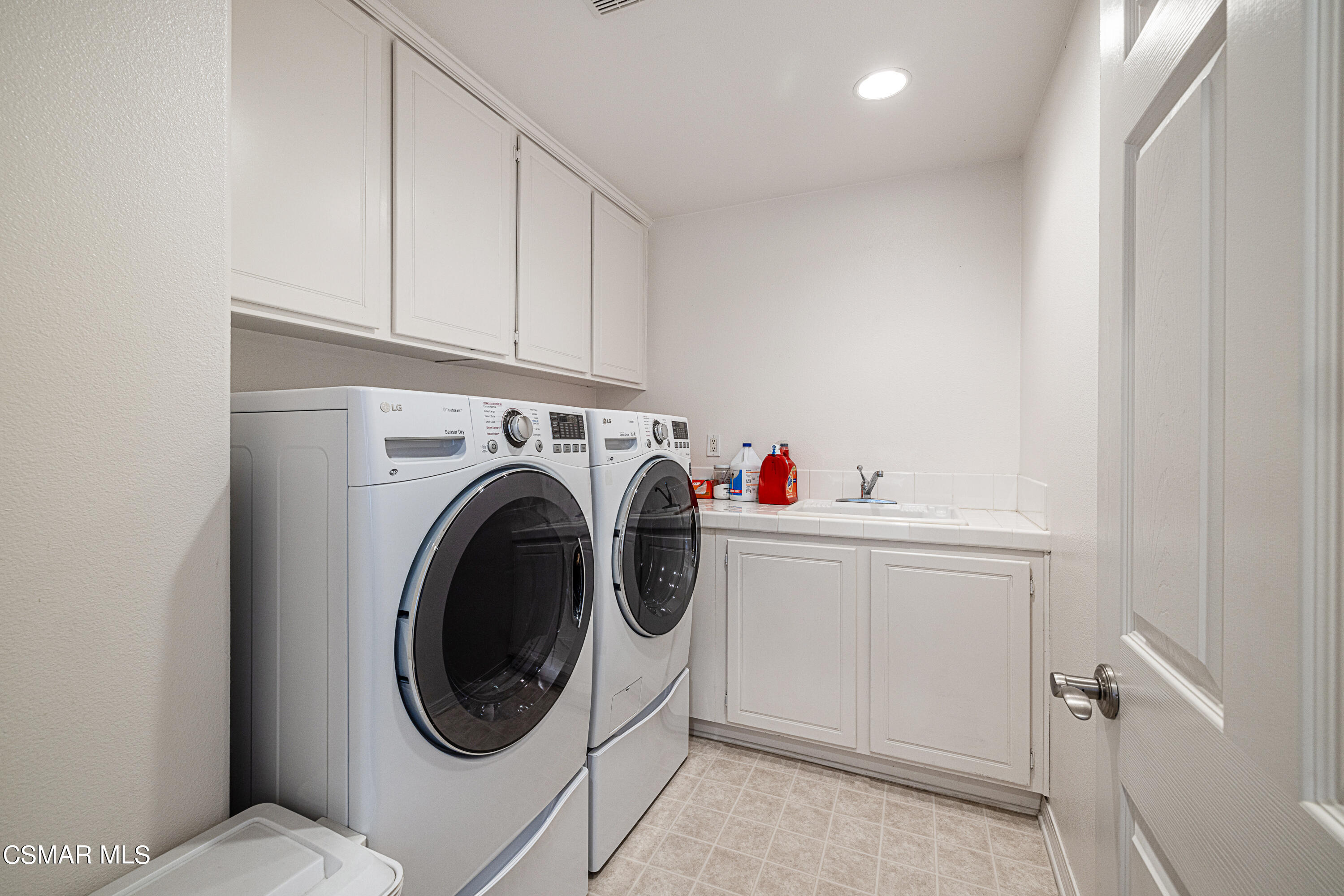 659 Corte Estrella Camarillo, CA 93010 - Photo 22 of 36 a utility room with dryer and washer