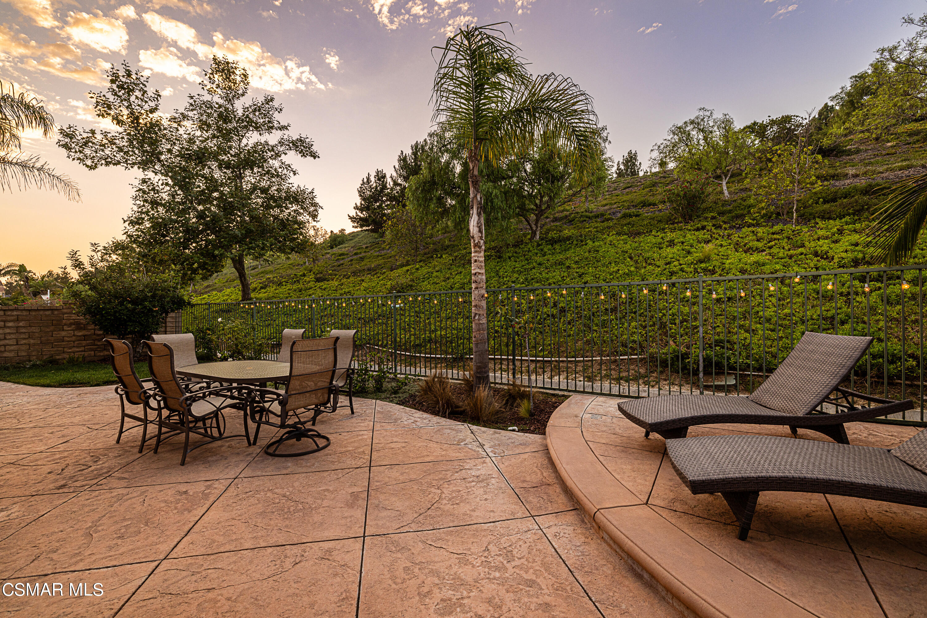 659 Corte Estrella Camarillo, CA 93010 - Photo 25 of 36 a view of a patio with a table and chairs