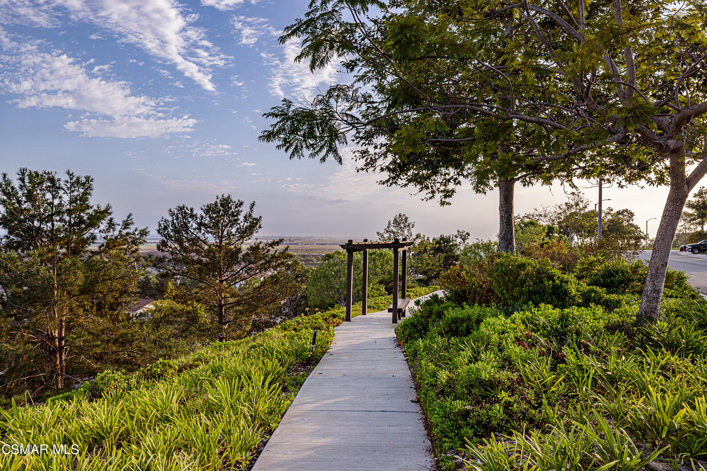 659 Corte Estrella Camarillo, CA 93010 - Photo 27 of 36 a view of a pathway with a wrought fence