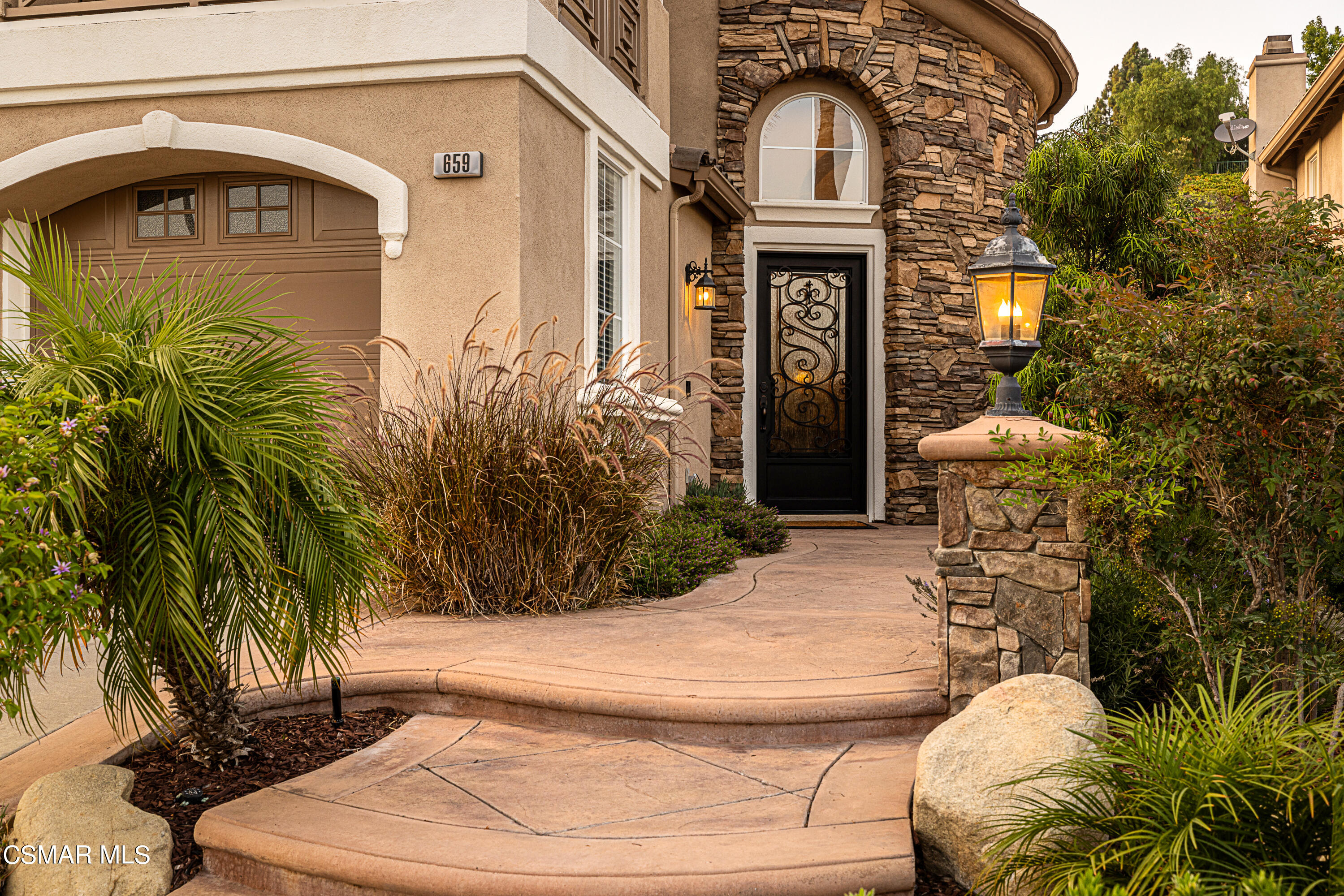 659 Corte Estrella Camarillo, CA 93010 - Photo 3 of 36 a front view of a house with a yard