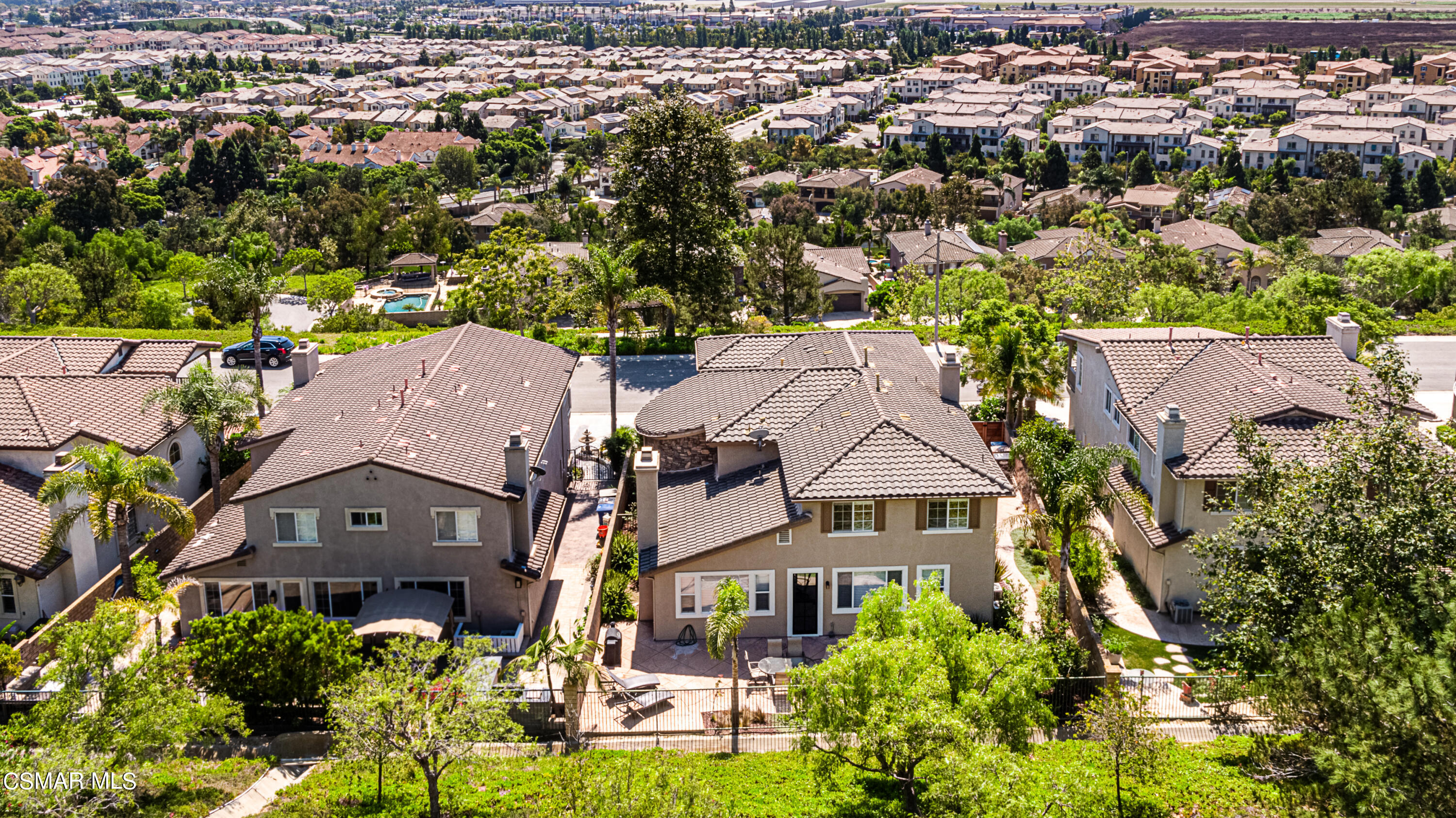659 Corte Estrella Camarillo, CA 93010 - Photo 33 of 36 an aerial view of a residential apartment building with a yard and parking spaces