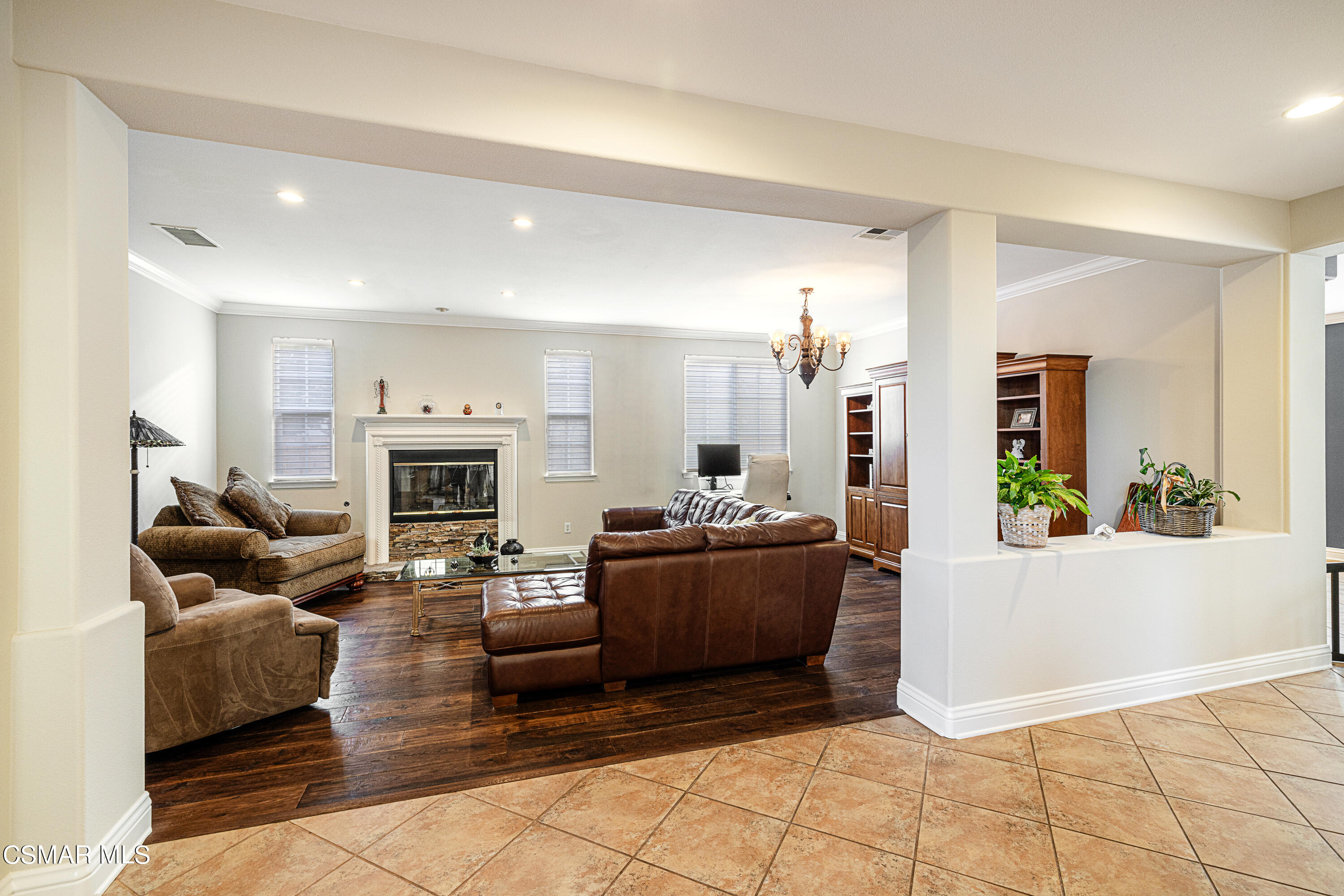 659 Corte Estrella Camarillo, CA 93010 - Photo 7 of 36 a living room with furniture and a fireplace