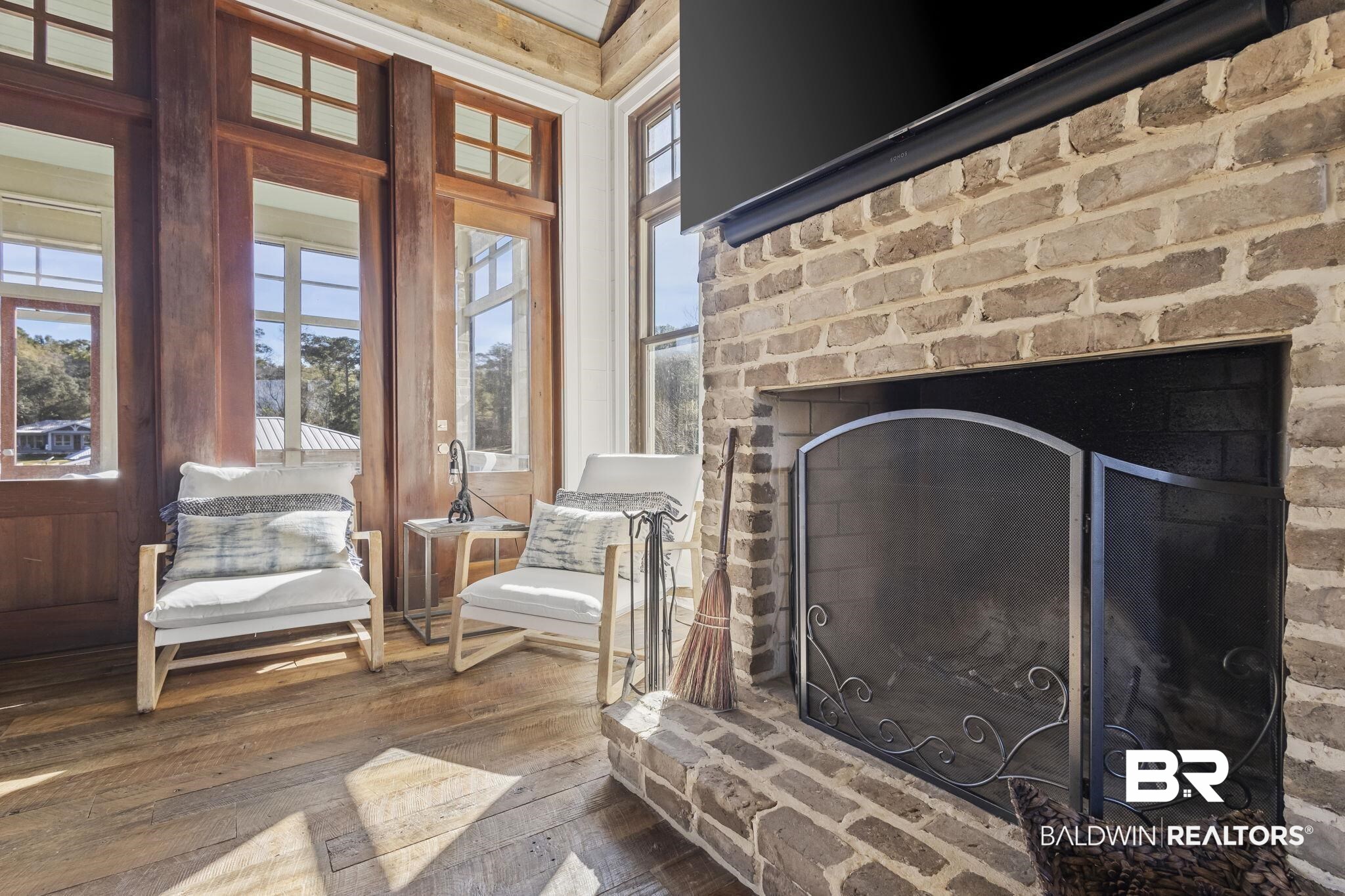 15020 River Road Fairhope, AL 36532 - Photo 10 of 59 Details featuring a brick fireplace and hardwood / wood-style flooring