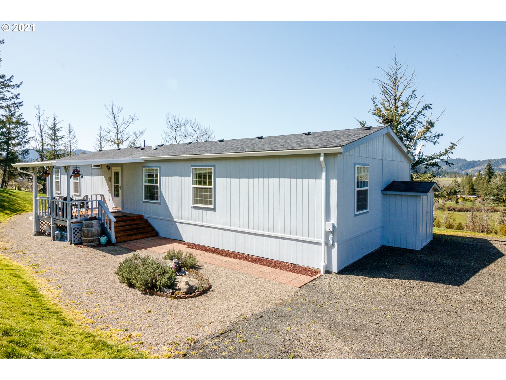 487 Fir Vista Road Sutherlin, OR 97479 - Photo 2 of 32 a view of a house with backyard and sitting area