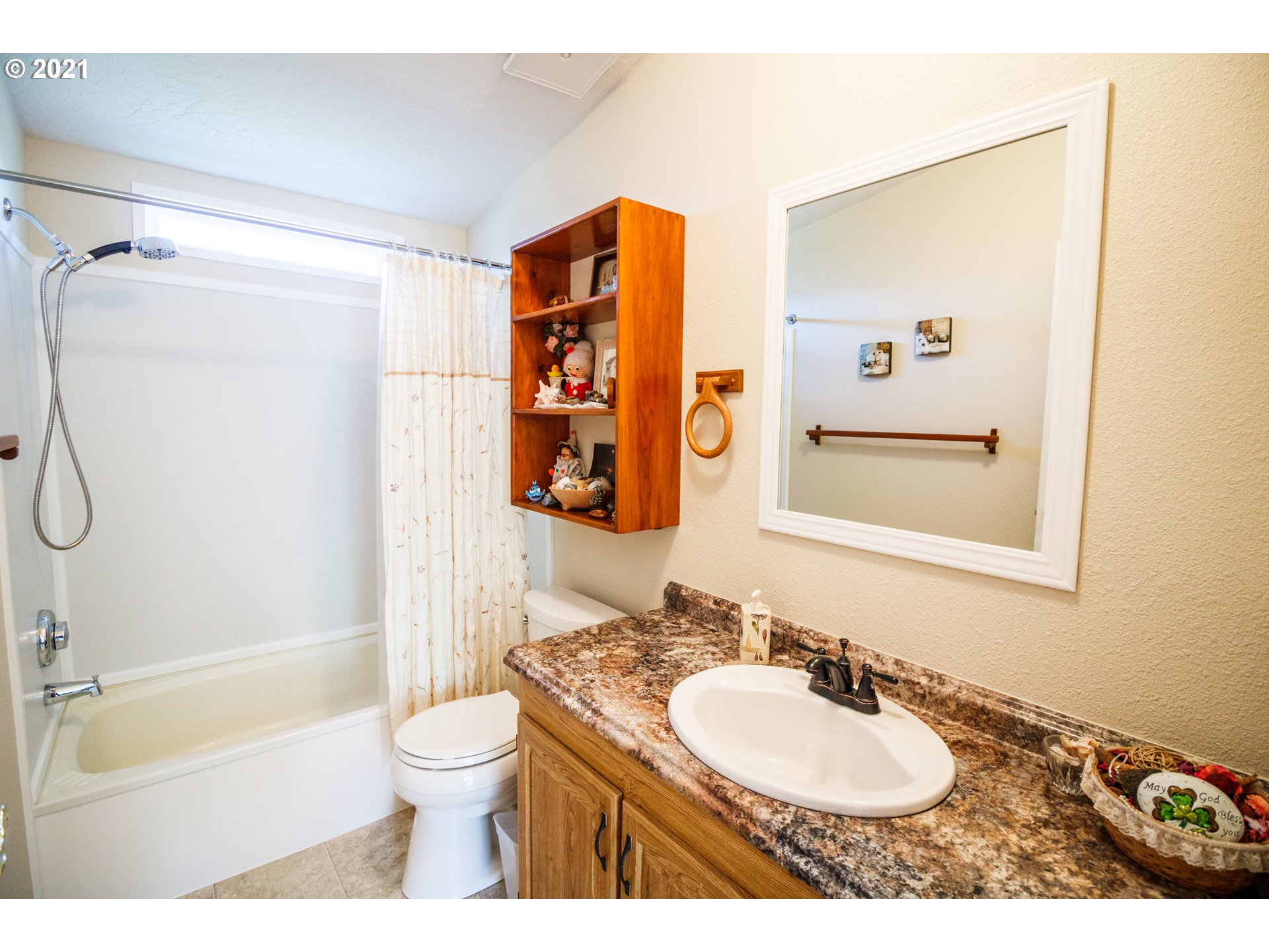 487 Fir Vista Road Sutherlin, OR 97479 - Photo 22 of 32 a bathroom with a granite countertop sink toilet a mirror and shower