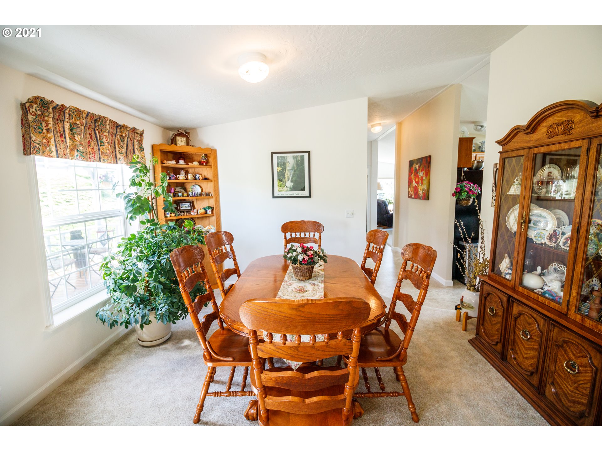 487 Fir Vista Road Sutherlin, OR 97479 - Photo 7 of 32 a view of a dining room with furniture and a window