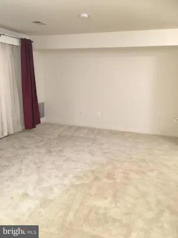 a view of a room with a bathtub