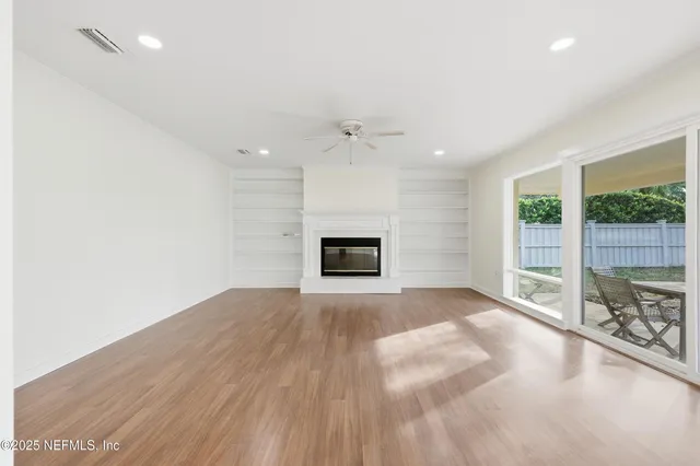 a kitchen with counter top oven and refrigerator
