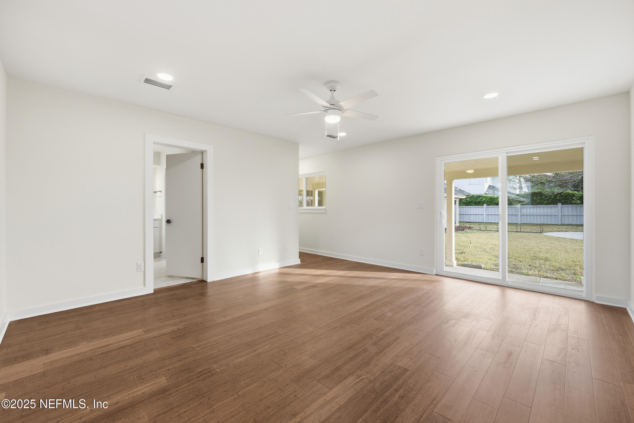 330 San Juan Drive Ponte Vedra Beach, FL 32082 - Photo 17 of 32 a view of an empty room with wooden floor and a window