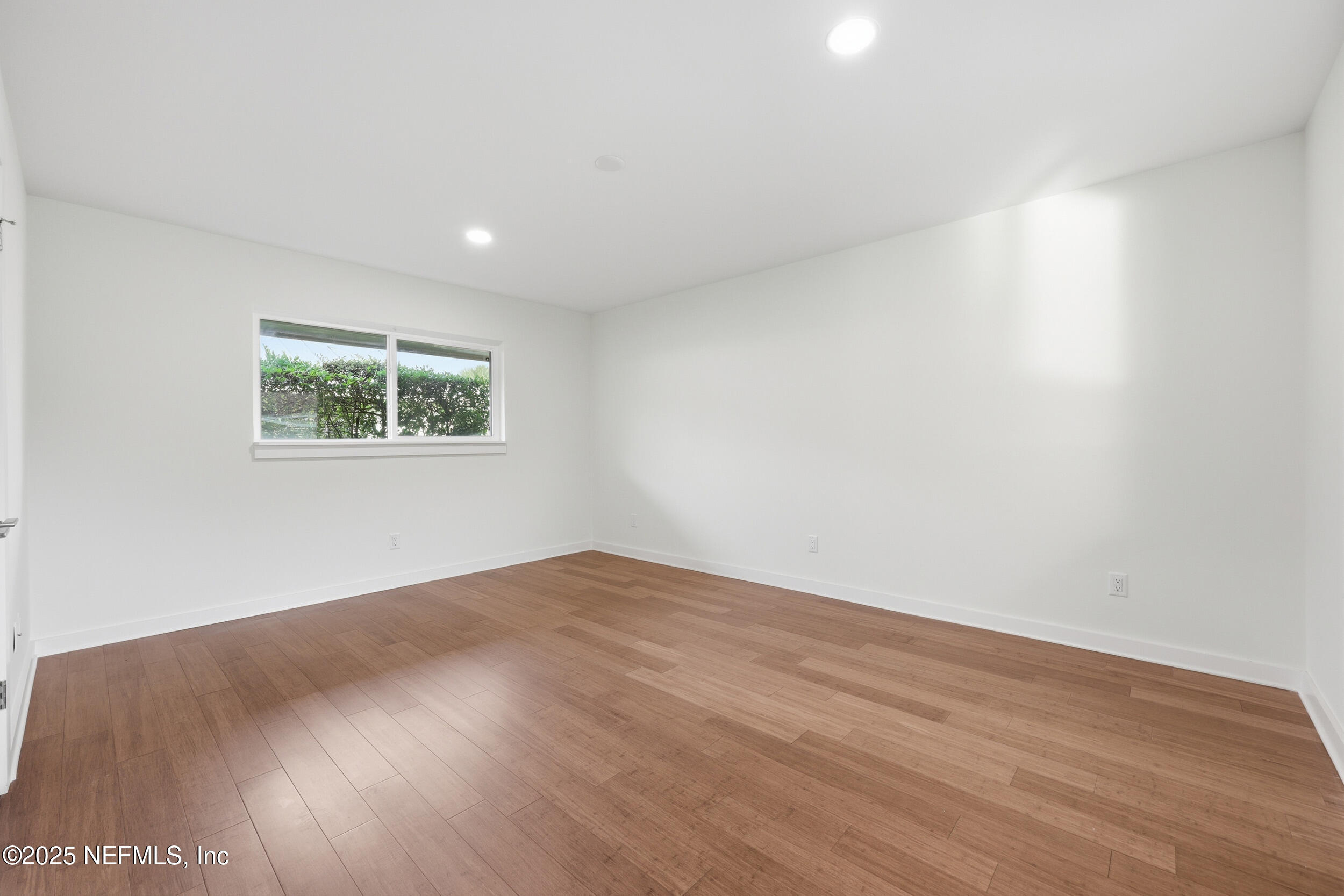 330 San Juan Drive Ponte Vedra Beach, FL 32082 - Photo 22 of 32 a view of an empty room with wooden floor and a window