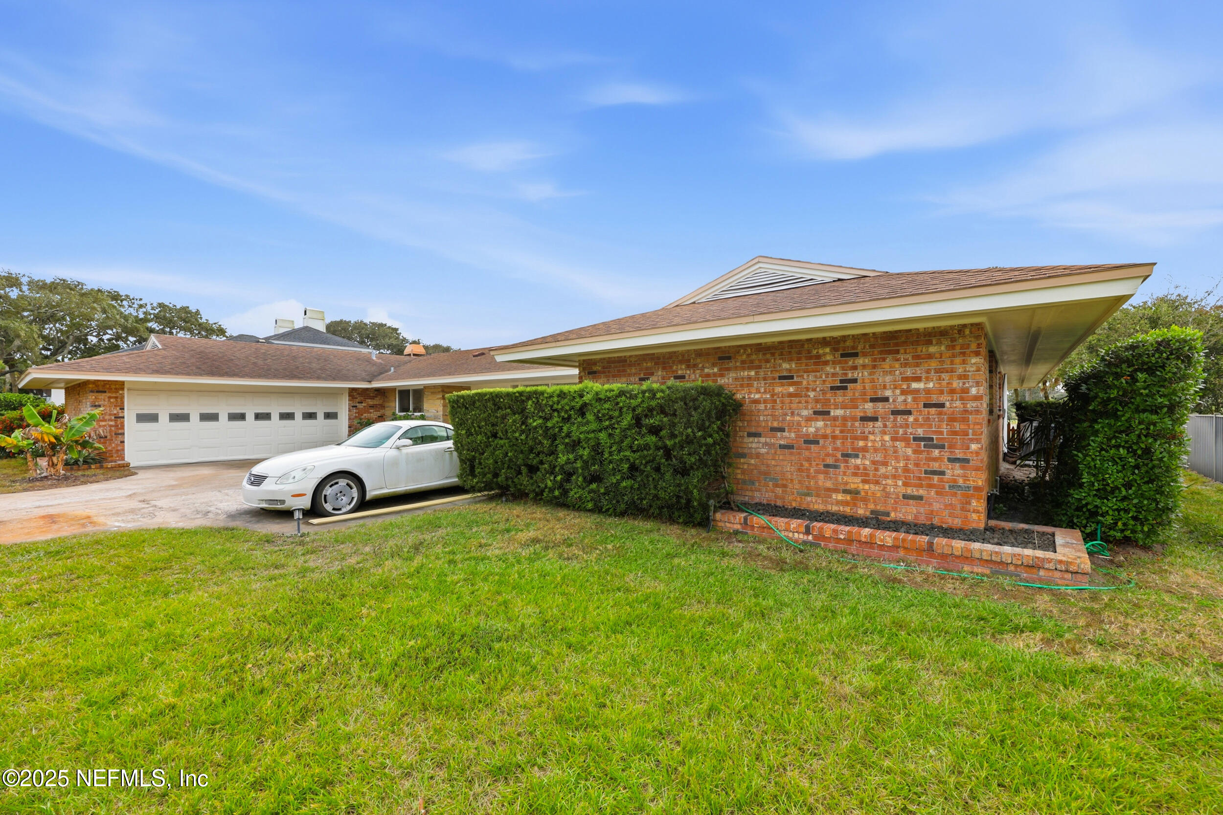 330 San Juan Drive Ponte Vedra Beach, FL 32082 - Photo 31 of 32 a view of a big house with a big yard and large tree