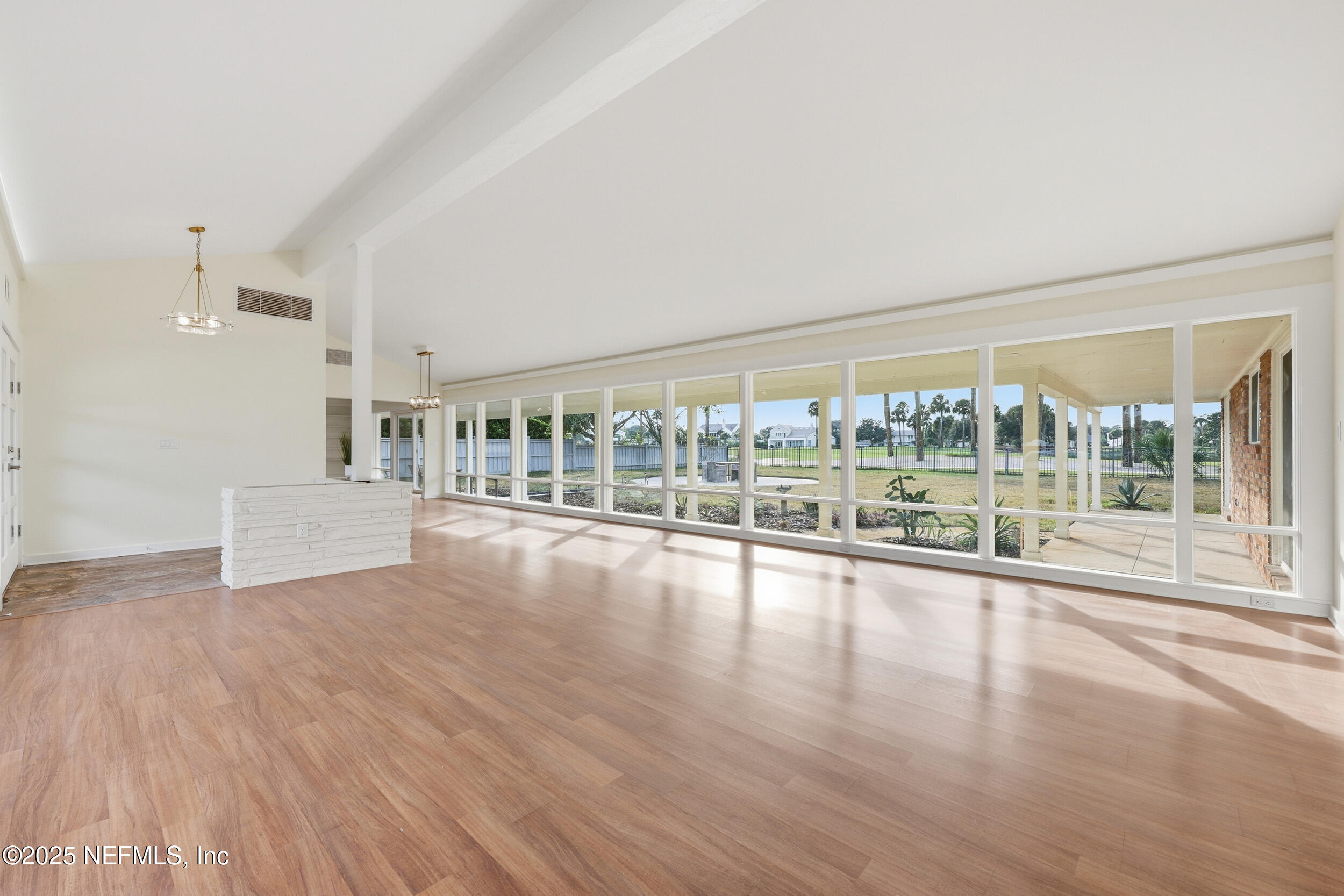330 San Juan Drive Ponte Vedra Beach, FL 32082 - Photo 8 of 32 a view of an empty room with wooden floor and a window