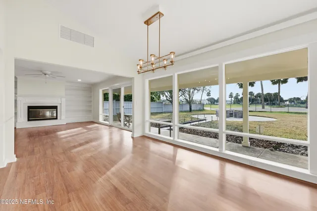 a view of a room with wooden floor