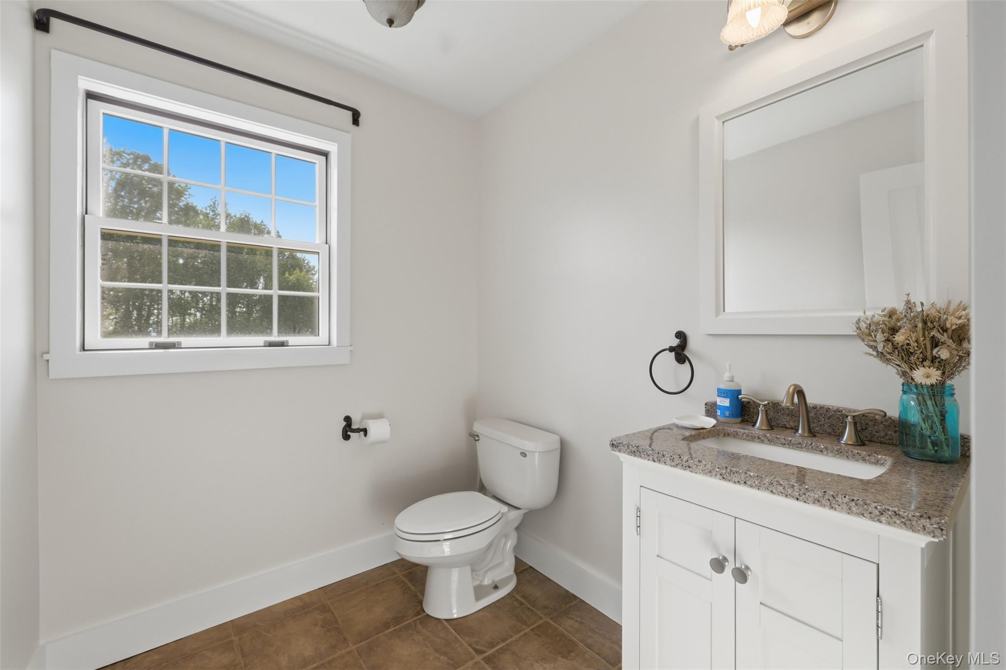 233 Devon Farms Road Stormville, NY 12582 - Photo 25 of 48 a bathroom with a granite countertop toilet sink and mirror