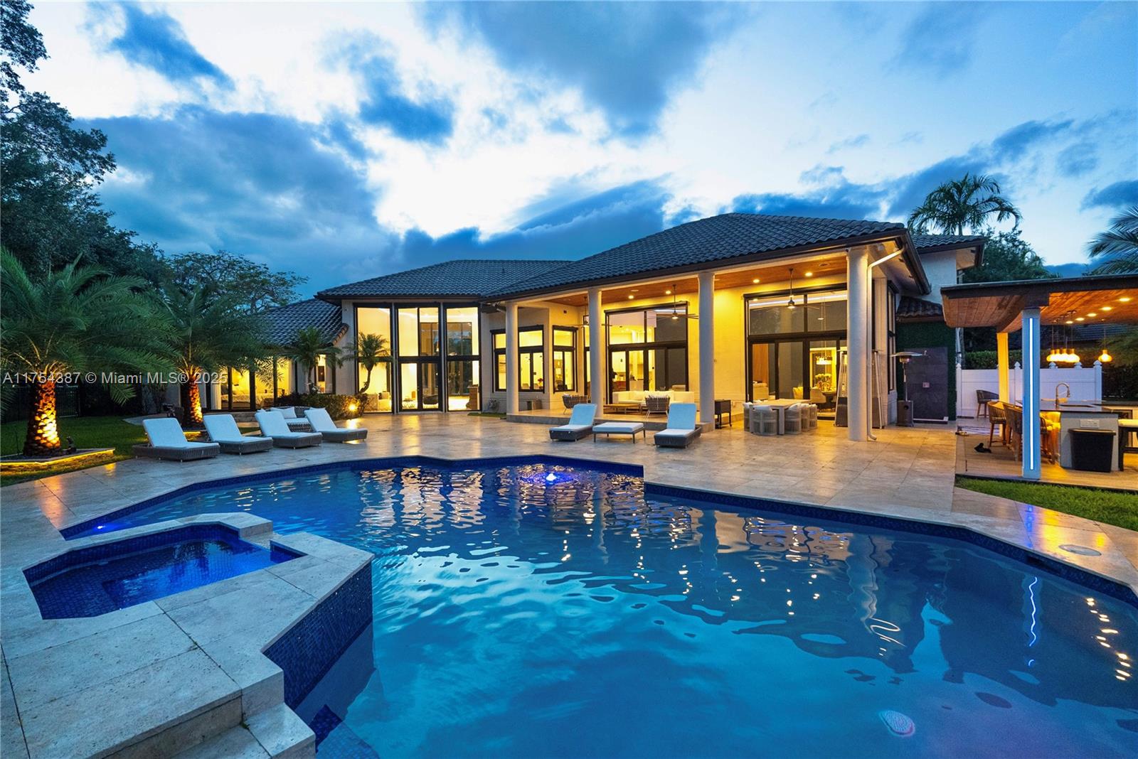 a view of a swimming pool with outdoor seating