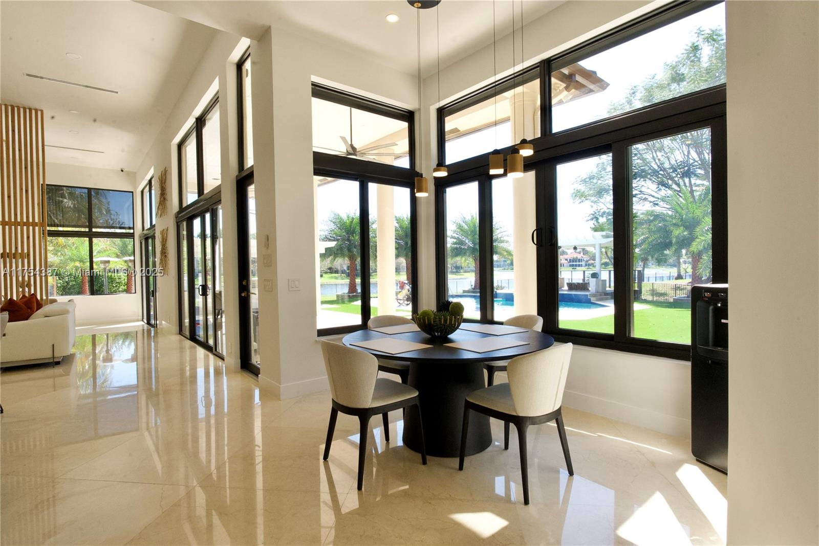 2980 Windmill Ranch Road Weston, FL 33331 - Photo 11 of 31 a view of a livingroom with furniture and large windows