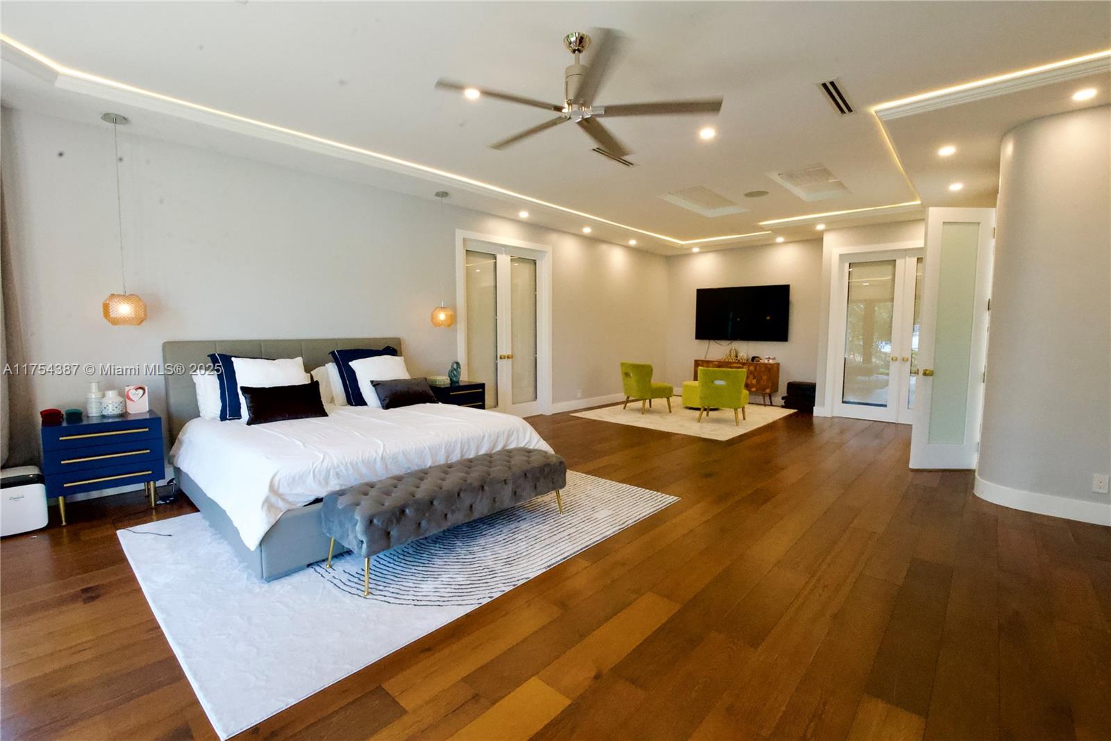 2980 Windmill Ranch Road Weston, FL 33331 - Photo 13 of 31 a bedroom with a large bed and a chandelier