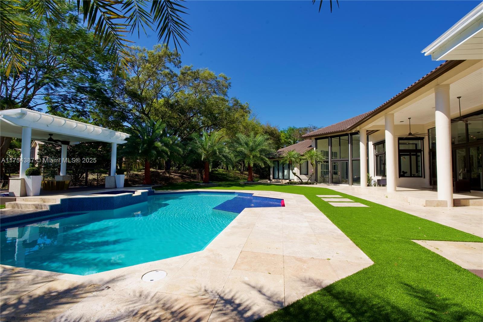 2980 Windmill Ranch Road Weston, FL 33331 - Photo 30 of 31 a view of a house with swimming pool and a yard