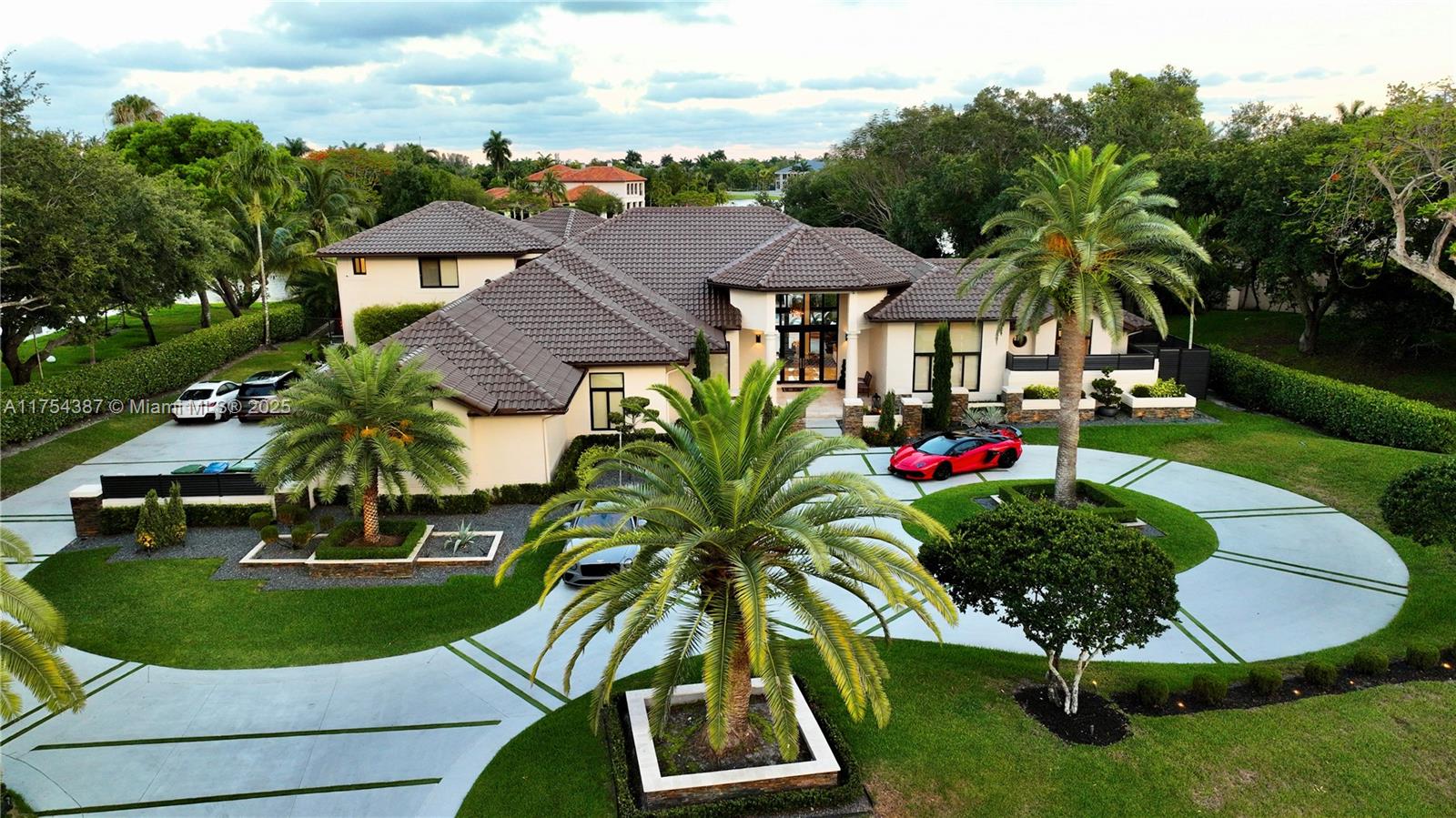 2980 Windmill Ranch Road Weston, FL 33331 - Photo 3 of 31 a backyard of a house with yard and outdoor seating