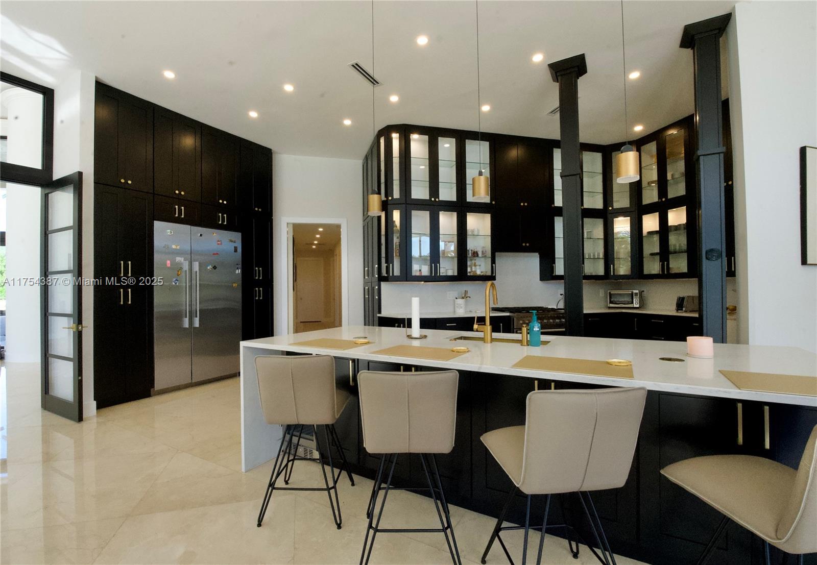 2980 Windmill Ranch Road Weston, FL 33331 - Photo 9 of 31 a large kitchen with a table and chairs