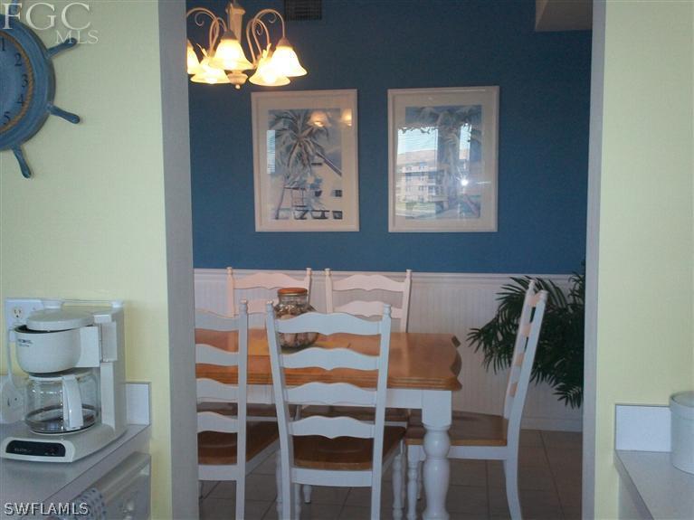 14111 Brant Point Circle, Unit 236 Fort Myers, FL 33919 - Photo 6 of 22 a dining room with furniture and window