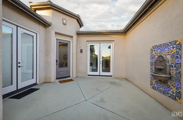 a view of a hallway with entryway and front door