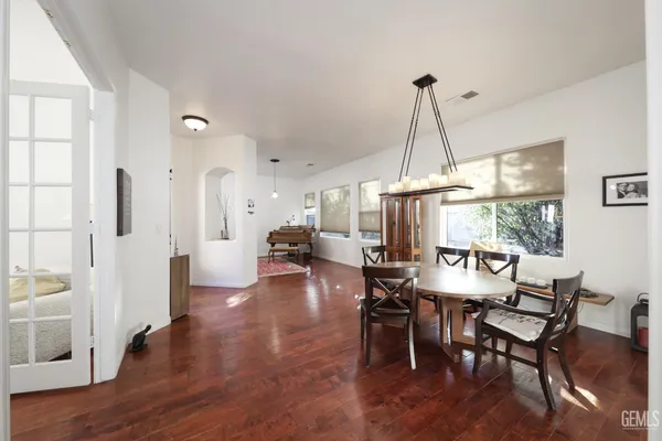 a view of a dining room with furniture window and wooden floor