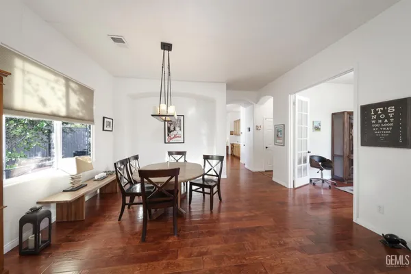 a view of a dining room with furniture window and wooden floor