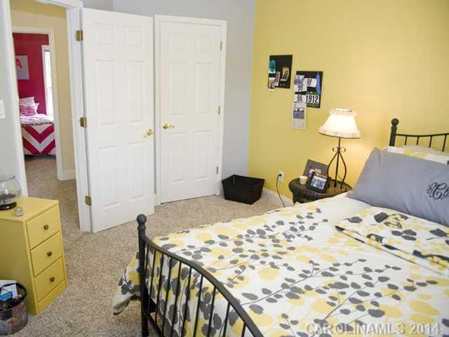 3829 Nancy Creek Road Charlotte, NC 28270 - Photo 13 of 16 a bedroom with a bed and wooden floor