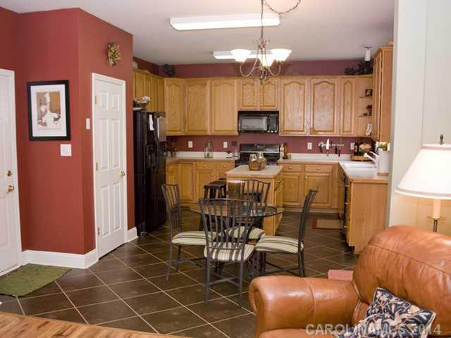 3829 Nancy Creek Road Charlotte, NC 28270 - Photo 7 of 16 a view of a dining room with furniture
