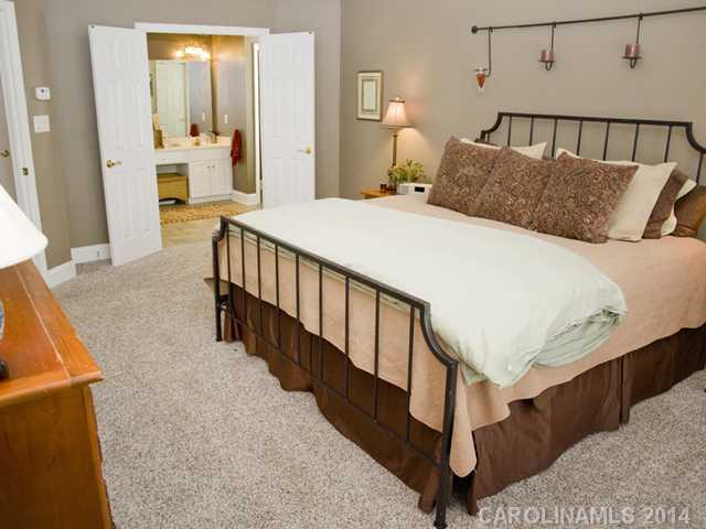 3829 Nancy Creek Road Charlotte, NC 28270 - Photo 9 of 16 a bedroom with a bed and wooden floor