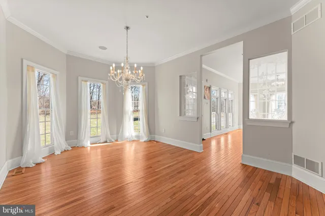 a kitchen with stainless steel appliances a refrigerator a sink a stove and cabinets