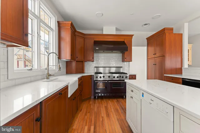 a large kitchen with a lot of counter space and a sink