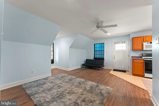 a kitchen with stainless steel appliances granite countertop a stove sink and cabinets