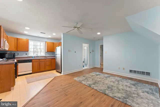 a bathroom with a shower a toilet and a sink