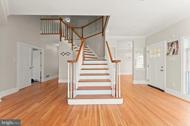 a view of an entryway with wooden floor