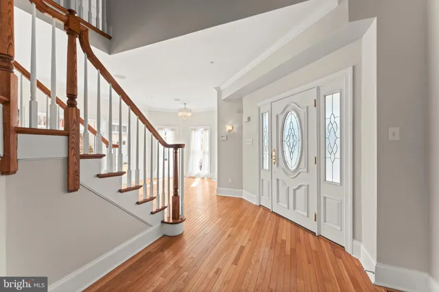 a view of an entryway with wooden floor and door