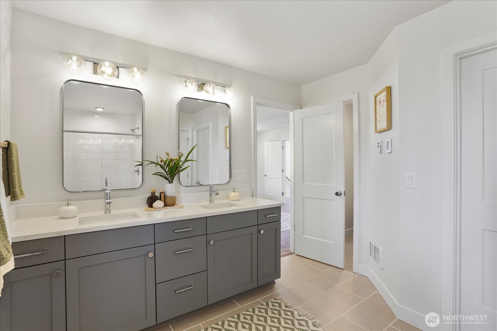 121 171st Place Southwest, Unit B Bothell, WA 98012 - Photo 25 of 36 a bathroom with a double vanity sink and mirror