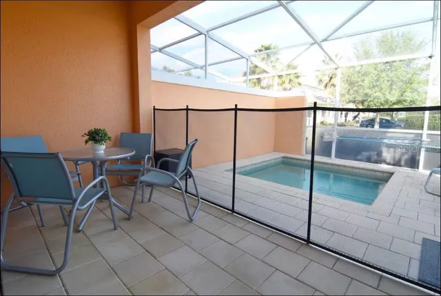 a dining room with furniture and a window