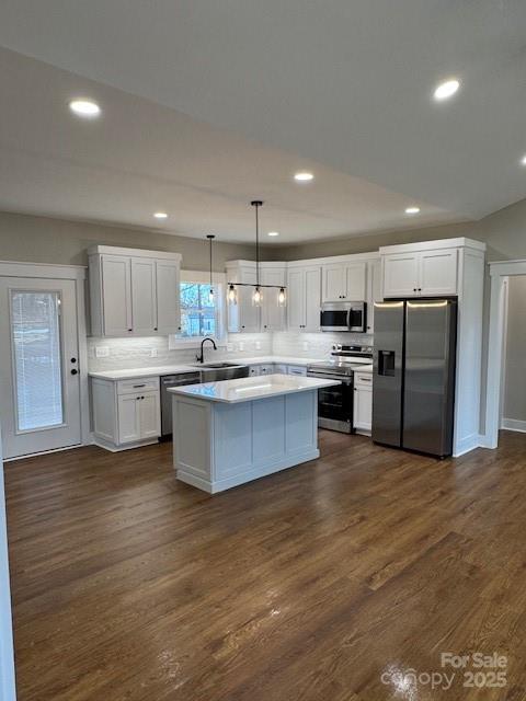 3006 Polkville Road Shelby, NC 28150 - Photo 8 of 29 a large kitchen with stainless steel appliances kitchen island a large counter top and wooden floors