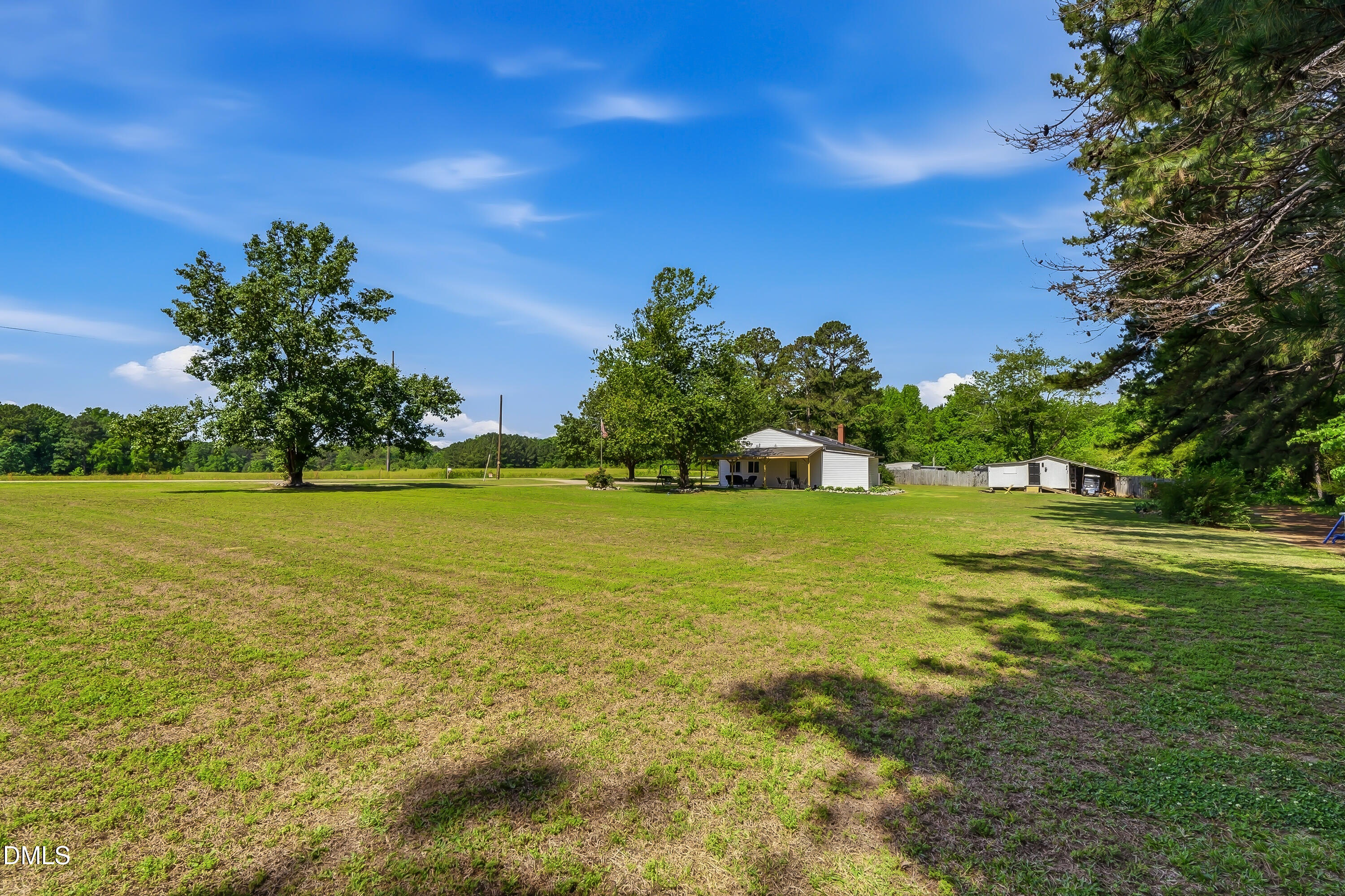 4967 Highway 581 Spring Hope, NC 27882 - Photo 12 of 44 a view of yard with swimming pool and green space