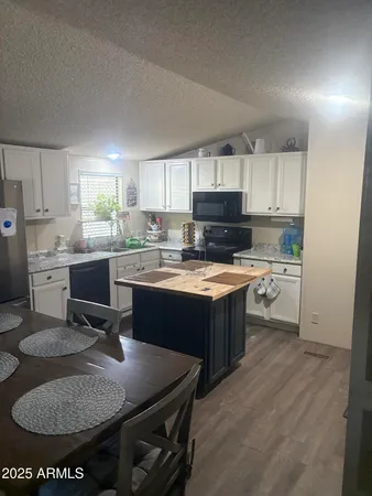 a bedroom with furniture and a chandelier