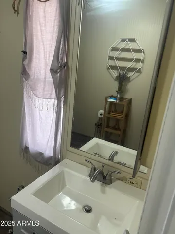 a bathroom with a sink a toilet and bathtub