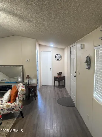 a view of a livingroom with furniture and toys